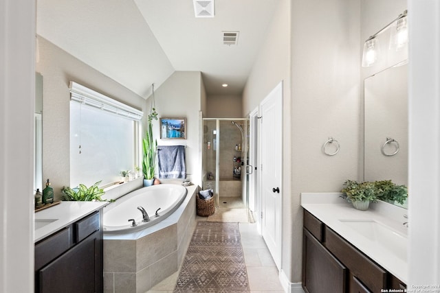 bathroom with tile patterned floors, vanity, and independent shower and bath