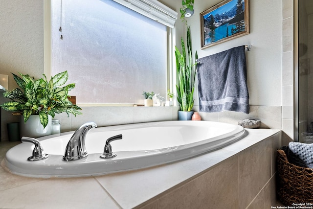 bathroom with tiled bath