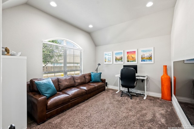 carpeted office space with vaulted ceiling