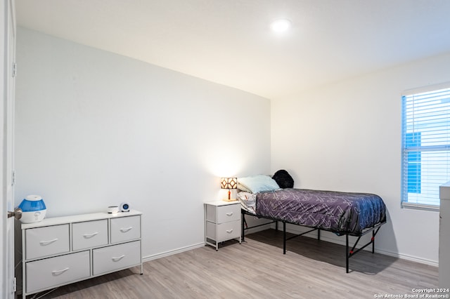 bedroom with light hardwood / wood-style floors