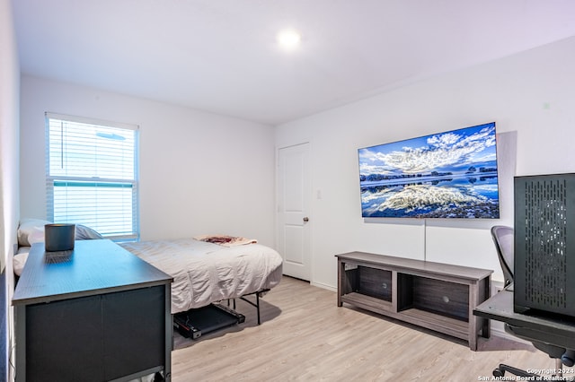 bedroom with light hardwood / wood-style flooring