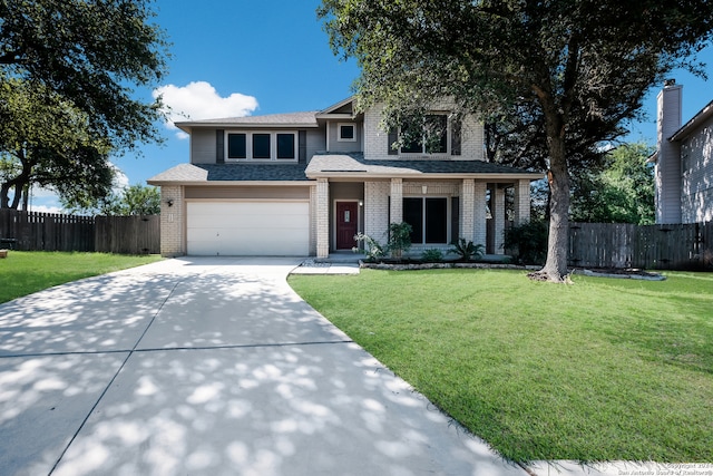 view of front of home with a garage and a front yard