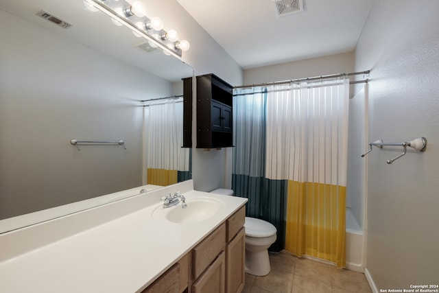 full bathroom with toilet, tile patterned floors, vanity, and shower / bath combination with curtain