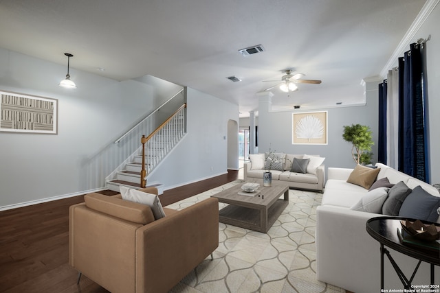 living room featuring ceiling fan, light hardwood / wood-style flooring, and ornamental molding