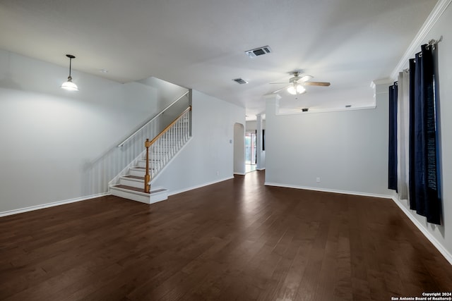 unfurnished living room featuring dark hardwood / wood-style flooring and ceiling fan