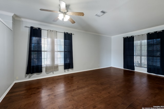 empty room with ceiling fan, crown molding, and wood-type flooring