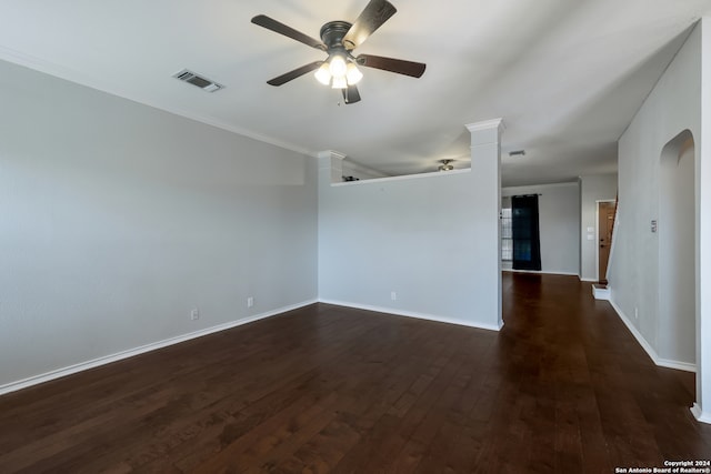 unfurnished room featuring ceiling fan, crown molding, and dark hardwood / wood-style floors