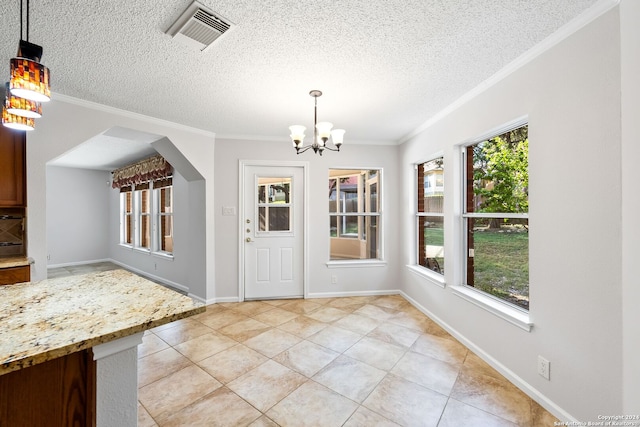 unfurnished dining area featuring ornamental molding, plenty of natural light, and visible vents