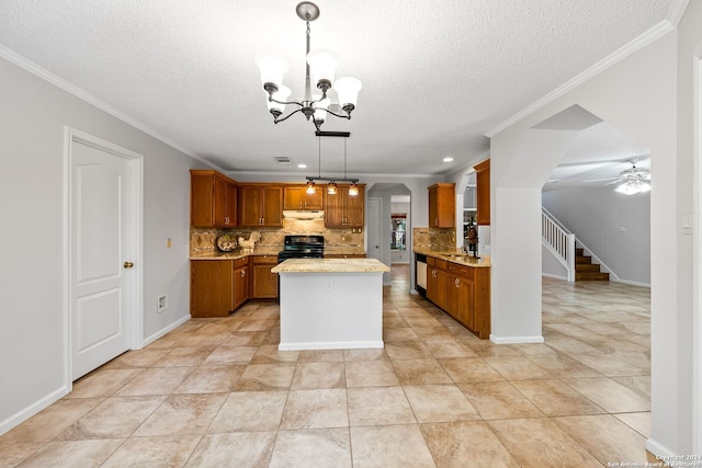 kitchen featuring arched walkways, under cabinet range hood, electric range, light countertops, and brown cabinetry