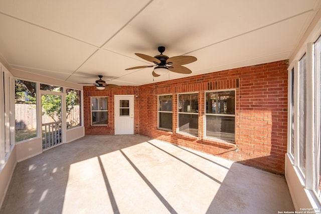 view of patio featuring ceiling fan and fence