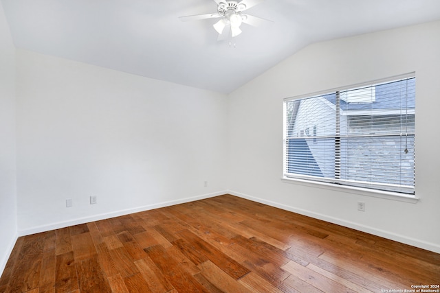 spare room with ceiling fan, hardwood / wood-style floors, and lofted ceiling