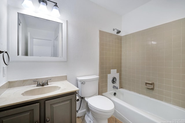 bathroom featuring washtub / shower combination, vanity, and toilet