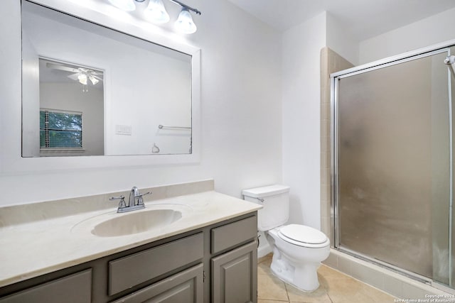 full bath with tile patterned flooring, toilet, vanity, a ceiling fan, and a shower stall