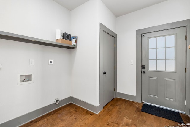 laundry room featuring electric dryer hookup, hardwood / wood-style floors, and washer hookup