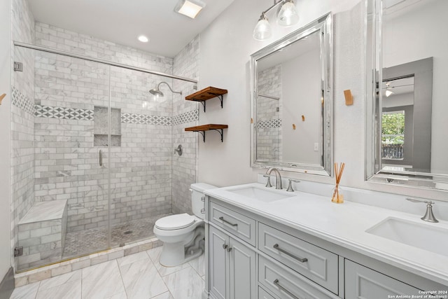 bathroom featuring a shower with door, double vanity, tile patterned floors, and toilet