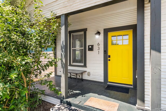 doorway to property with a porch