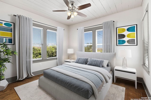 bedroom featuring ceiling fan and dark hardwood / wood-style flooring