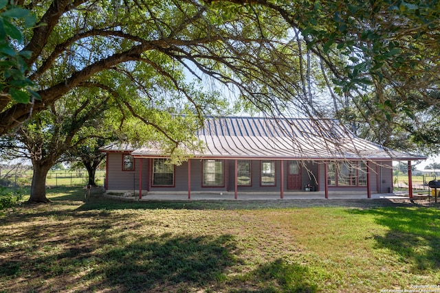 view of front of house featuring a front yard and covered porch