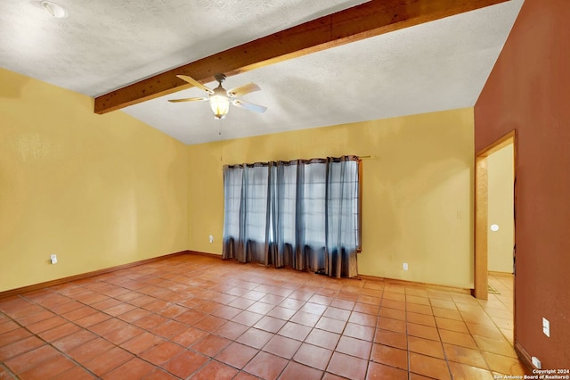 spare room featuring a textured ceiling, lofted ceiling with beams, tile patterned floors, and ceiling fan