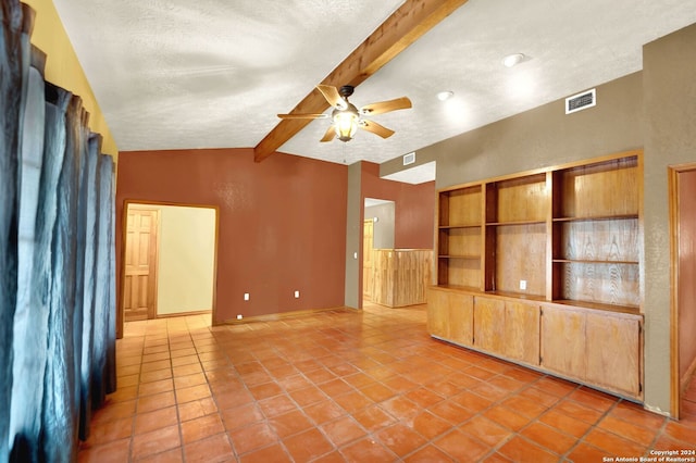 unfurnished living room featuring ceiling fan, lofted ceiling with beams, a textured ceiling, and light tile patterned floors