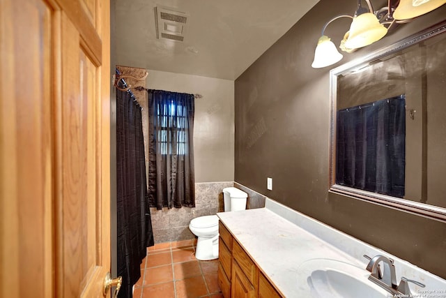 bathroom featuring tile walls, toilet, tile patterned floors, and vanity