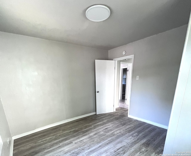 spare room featuring hardwood / wood-style flooring