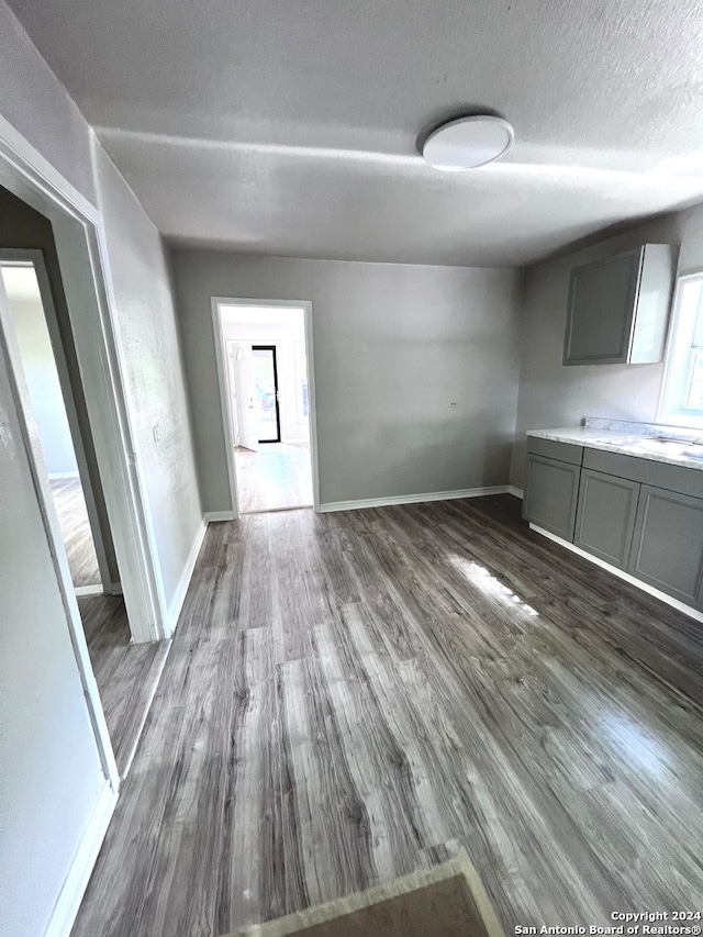 interior space with a textured ceiling, hardwood / wood-style floors, and a wealth of natural light