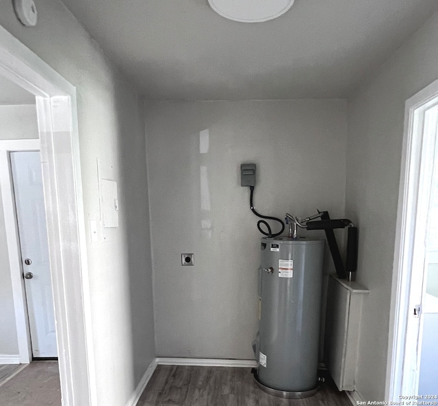 utility room featuring water heater