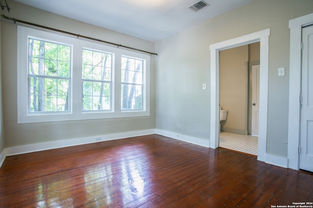 tiled empty room with a healthy amount of sunlight