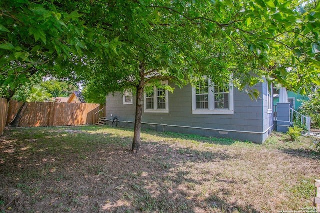 view of home's exterior with a lawn