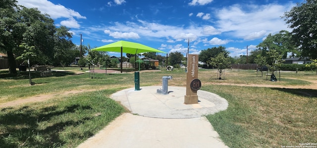 view of community featuring a lawn and a playground