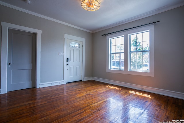 foyer entrance featuring ornamental molding and hardwood / wood-style floors