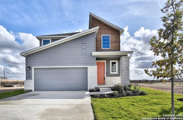 view of front of home featuring a garage and a front lawn