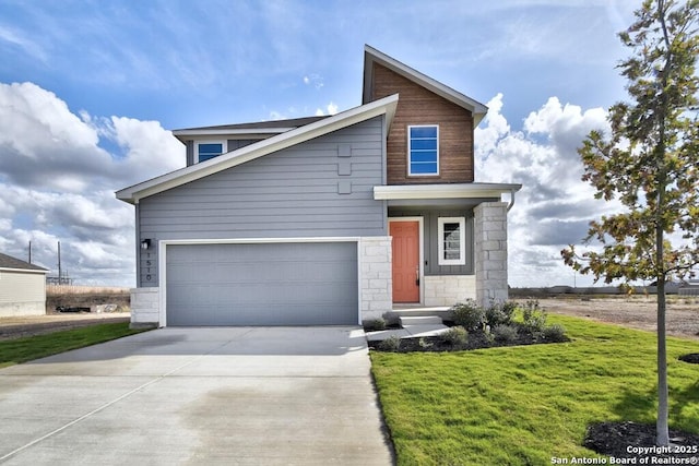 view of front of house with a garage and a front yard