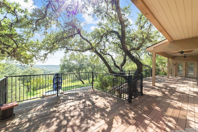 wooden terrace featuring ceiling fan