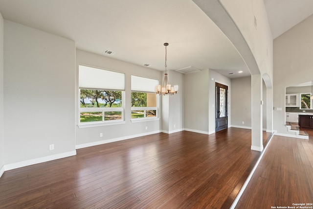 interior space featuring hardwood / wood-style floors, a chandelier, and a healthy amount of sunlight