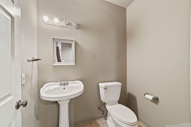 bathroom featuring tile patterned flooring and toilet