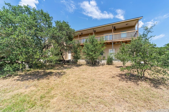 view of yard featuring a balcony