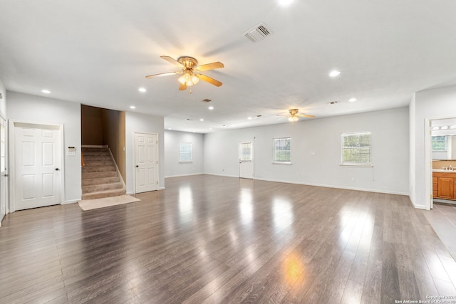 unfurnished living room with ceiling fan and light wood-type flooring