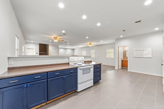 kitchen with ceiling fan, blue cabinets, electric range, and light tile patterned floors