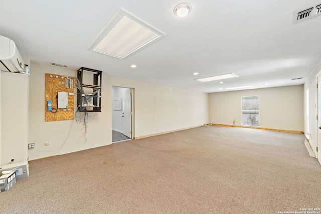 basement featuring a wall mounted AC and light carpet