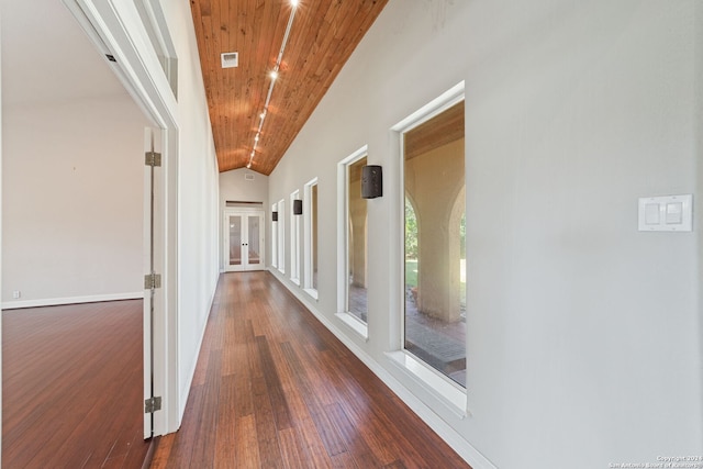 hall featuring wooden ceiling, dark wood-type flooring, and lofted ceiling