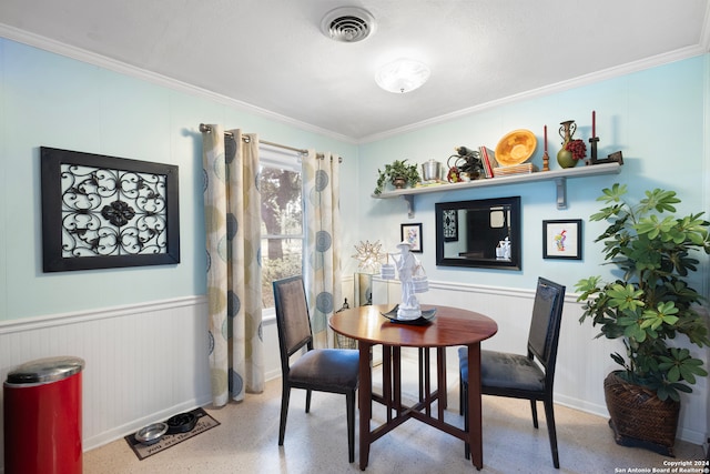 dining room featuring ornamental molding