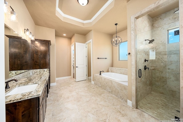 bathroom with tile patterned floors, a raised ceiling, plus walk in shower, and vanity