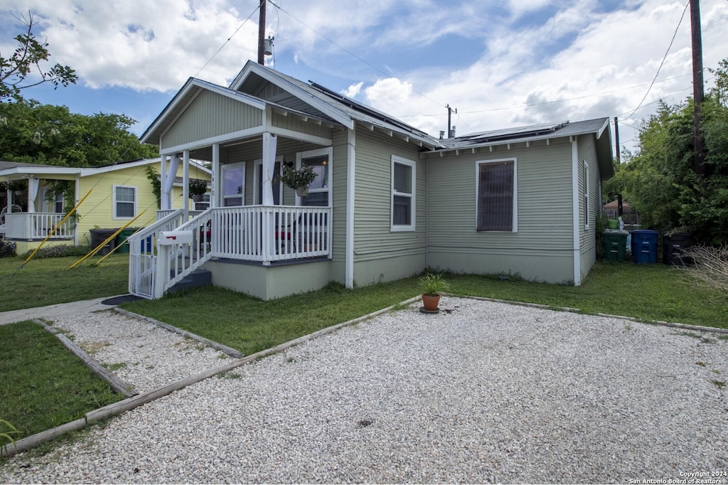 bungalow featuring a porch and a front yard