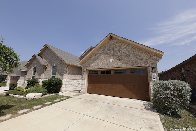 view of front of property with a garage