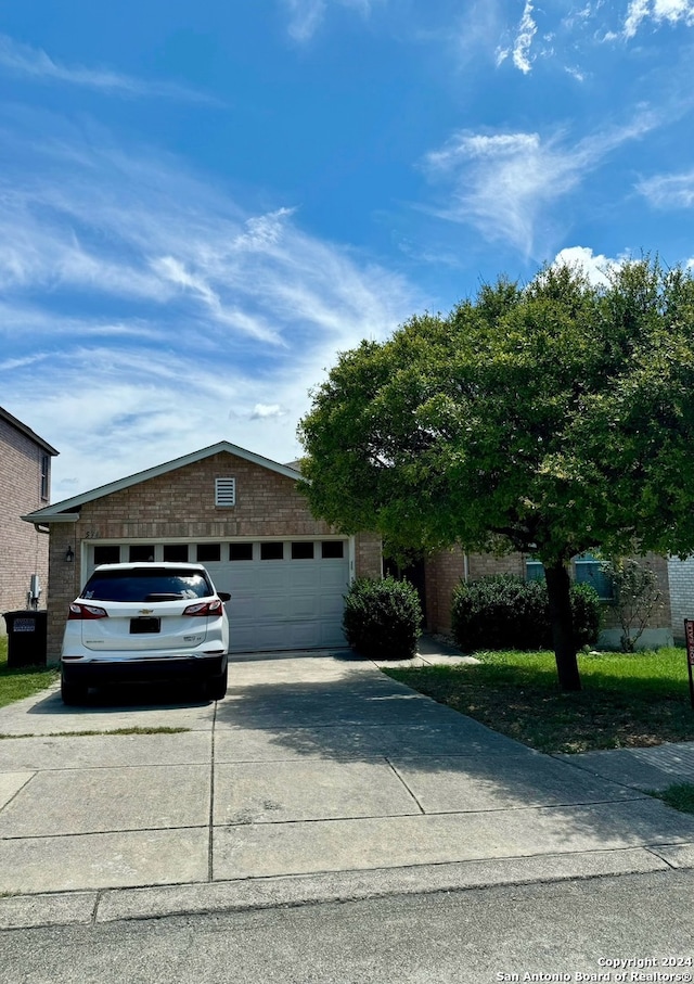 single story home with a garage