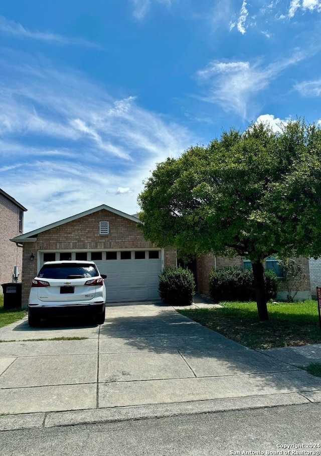 534 Gable Pt, San Antonio, TX 78251 - view of front of home with a garage, driveway, and brick siding