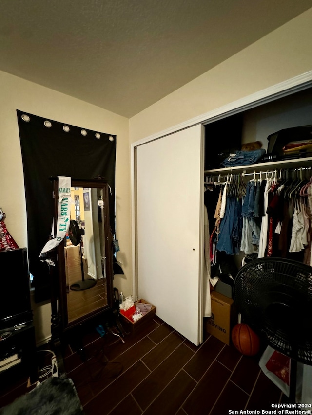 bedroom with a closet and wood-type flooring