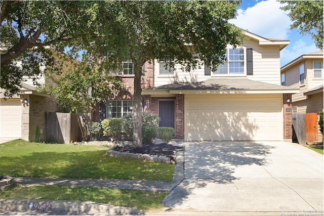 view of front of house with a front lawn and a garage